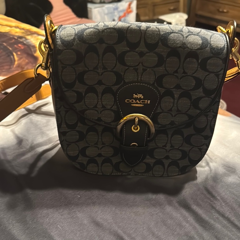 Coach Black and Gold Jeans with Elegant Design
